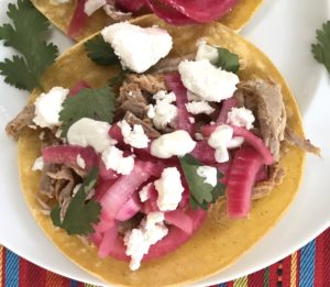 These Pork Carnitas Tacos  have shredded pork tenderloin topped with pickled red onions, goat cheese & tangy cilantro lime crema.  On the side, Creamy Corn with goat cheese...wha!?!?  Yep, goat cheese is tangy, sweet, salty and oh-so-creamy for an unexpected, but absolutely delicious combination!  