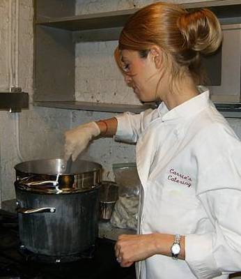 Carrie Cooking in a commercial kitchen for her catering business.