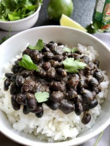 Slow Cooker Brazilian Black Beans are thick, rich, and delicious! Serve as a side or main over rice.