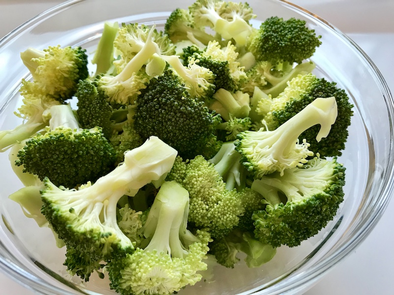 Broccoli florets on plate for Cheesy Chicken Sausage & Broccoli Rice Casserole