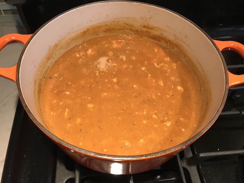 Creamy Tomato Soup with Ground Chicken in pot. It is creamy and chunky and has a ton of deep flavor. AND it is healthy! It uses all white meat ground chicken that you cook until it is incredibly browned for some serious flavor. Then tomato paste adds the flavor back drop for the soup and a flour roux plus broth creates the amazing creaminess! Finally Spinach is your veggie boost.