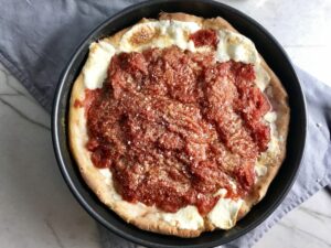 This Chicago Style Pizza is a lighter and healthier version, but still AMAZING! It still has all of the gooey mozzarella cheese, but uses homemade turkey Italian Sausage, that's so delicious!
