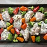 Cilantro Lime Yogurt Chicken, Peppers & Broccoli on a pan with sauce
