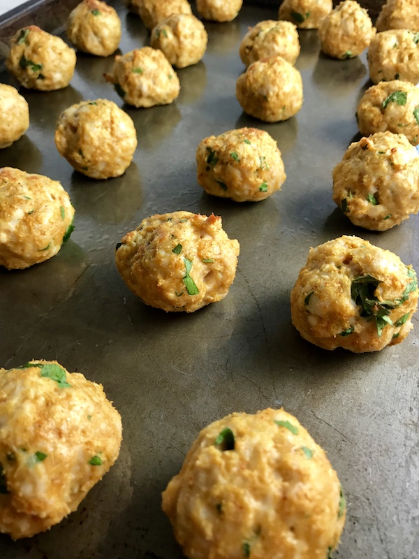 Cooked Moroccan turkey meatballs on a sheet pan to go into Pita Bread Sandwiches Recipe.
