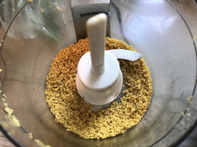 Tortilla chip crumbs in a food processor for Chipotle Meatballs with Mexican Corn Cream Sauce