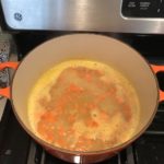 5-Ingredient Chunky Chicken Vegetable Soup in a bowl on counter with spoon in bowl. It's creamy (but there is no dairy!) and chunky, and delicious!  With loads of chicken, carrots, and peas.
