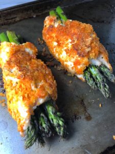 DORITO-CRUSTED-CHICKEN and Asparagus Rolls!  Yes, Doritos, my friend.  The Doritos add a salty and crispy crust to the outside of the chicken with a hint of cheesy flavor.  The Chicken stays moist and juicy rolled up and you get this fresh bite of Spring in the center with the Asparagus.