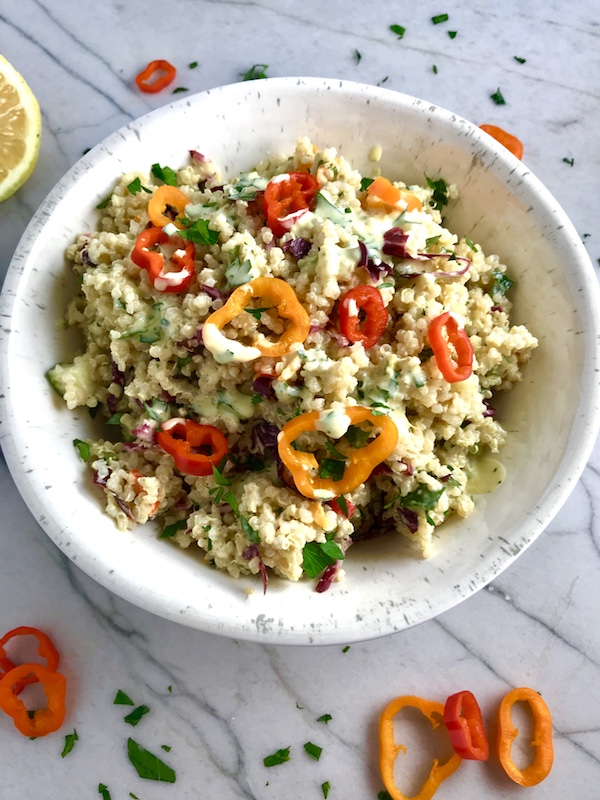 Veggie Quinoa Salad with Creamy Lemon Dressing is loaded with flavor, texture, color and is both delicious and nutritious! This Quinoa Veggie Salad has cucumber, sweet peppers, radicchio, scallions, and parsley. The dressing is a bright Creamy Lemon Dressing with Lemon, honey, mustard, and sour cream. 