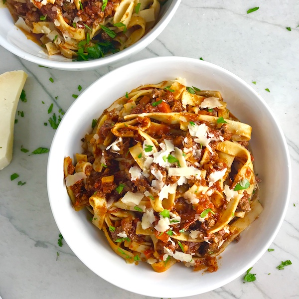 Slow Cooker Beef Bolognese is a souped-up version of the traditional Italian Meat Sauce made EASY in the slow cooker! The flavors of the ingredients with the meat become one and turn into this amazing thick sauce. I add even MORE FLAVOR with Pancetta and Demi-Glace. Delicious!
