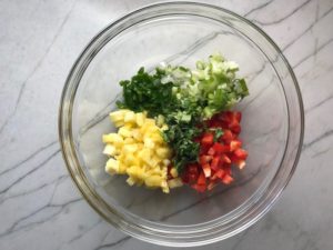 Fresh, bright, sweet, creamy, crunchy, and bursting with flavor, this Zippy Pineapple Salsa has red pepper, jalapeño, cilantro, scallion, lime, and avocado. It's the perfect topping for just about anything grilled. It's also just perfect for eating with chips or as a salad on it's own!