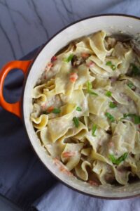 Stove top Easy Tuna Casserole in a pot on counter. This is a creamy and delicious comfort dish with tuna and noodles and a surprise pop of sweet from Pimiento.  This easy recipe is completely from scratch (no canned soup here!) but I can promise you it's so easy and only takes 30 minutes because it's a Casserole that you can make entirely on the stove top!