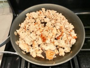 Ground Chicken in a skillet on the stove really browned for Moroccan Chicken Chili with Chickpeas is loaded with comforting and healthy ingredients and spices. You get warmth from Ginger, Turmeric, Garlic, and Coriander. Then tons of hearty flavor from browned ground chicken and Shallots. And creaminess from the Carrots and Chickpeas. You can make it ahead and freeze it until you are ready to cook it!