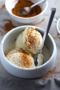Pumpkin Spice on vanilla ice cream with spice blend in background in bowl. Recipe has 4 simple ingredients and takes minutes to make! PLUS, here are 20 EASY WAYS TO USE this Spice blend, many with no baking at all!