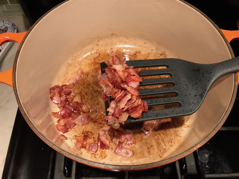 Cooked bacon in pot for the Easy Bacon Brussel Sprouts and Chicken recipe. It's a perfect quick Fall Recipe!  It has a creamy sauce filled with salty bacon, earthy and almost nutty seared brussel sprouts, and hearty healthy chicken. Serve over rice (or Quinoa or pasta!).