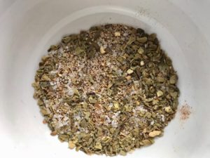 Spices mixed in bowl for Flank Steak Rub. This Flank Steak Recipe with Potatoes & Broccoli is an easy and delicious Sheet Pan Dinner. It has a flavorful rub and a tangy, light Garlic Chive Crema!