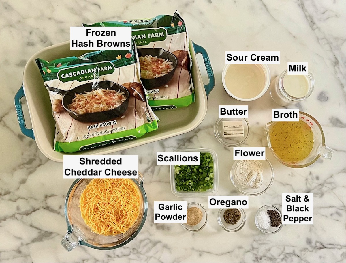 Ingredients prepped and measured out in small bowls, labeled on counter for Hash Brown Casserole without Soup.