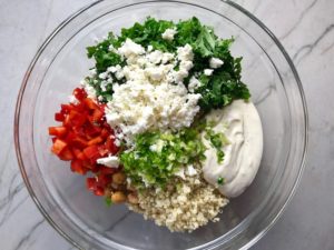 All ingredients in bowl for Quinoa & Kale Salad with Roasted Chickpeas, Pomegranate, Feta, red pepper, and Creamy Lemon Dressing. #glutenfree #lunch #dinner #healthyrecipes #healthyfood #salads #quinoa #kale