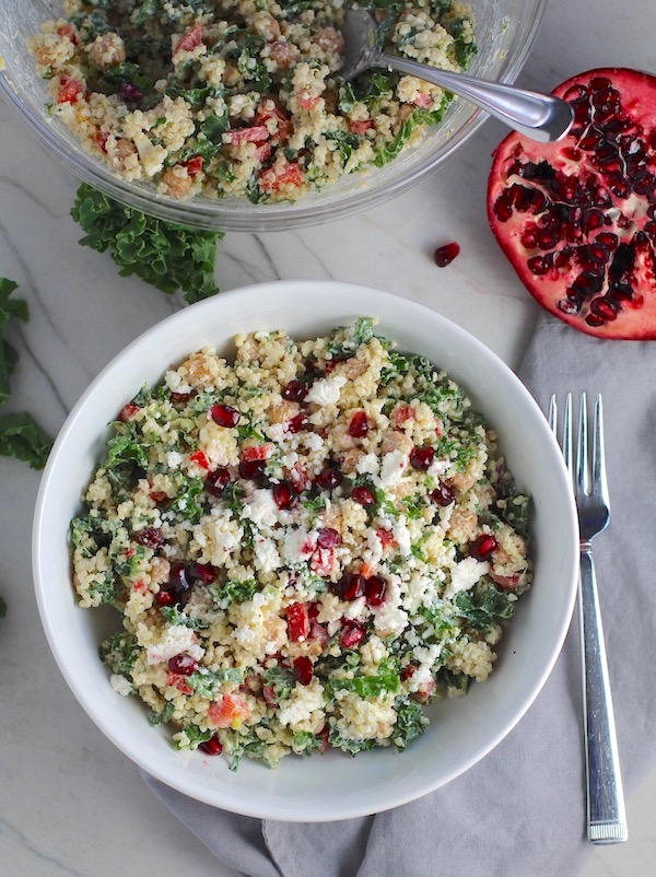 Bowl of Quinoa & Kale Salad with Roasted Chickpeas, Pomegranate, Feta, red pepper, and Creamy Lemon Dressing. #glutenfree #lunch #dinner #healthyrecipes #healthyfood #salads #quinoa #kale