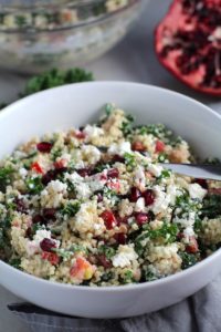 Close up of bowl of Quinoa & Kale Salad with Roasted Chickpeas, Pomegranate, Feta, red pepper, and Creamy Lemon Dressing. #glutenfree #lunch #dinner #healthyrecipes #healthyfood #salads #quinoa #kale