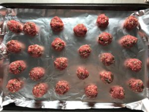 Raw meatbals on sheet pan for Meatballs in Cauliflower Dill Cream Sauce. #meatballs #swedishmeatballs #familydinner #easydinner #dinner #healthydinner