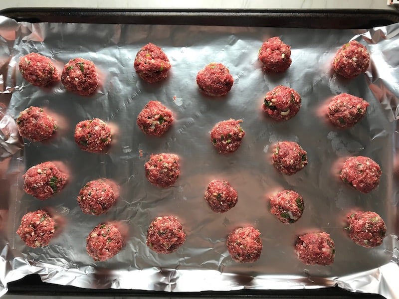 Raw meatballs on sheet pan for Meatballs in Cauliflower Dill Cream Sauce. #meatballs #swedishmeatballs #familydinner #easydinner #dinner #healthydinner