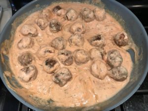 Dill Cream Sauce and cooked meatballs in skillet for Meatballs in Cauliflower Dill Cream Sauce. #meatballs #swedishmeatballs #familydinner #easydinner #dinner #healthydinner