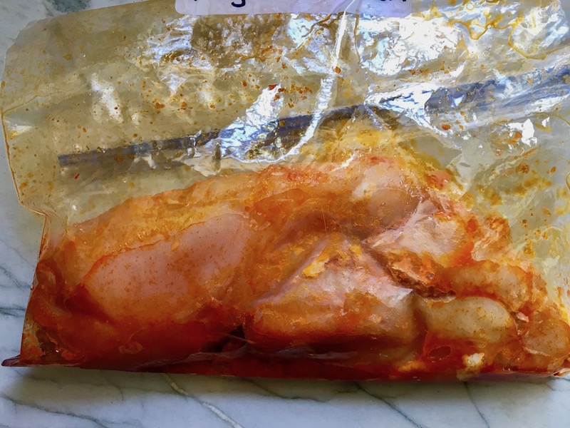 Hungarian Paprika Chicken raw marinating in a bag. The paprika gives beautiful color and a deep, peppery flavor. #chicken #easychicken #easydinner #dinner #healthydinner