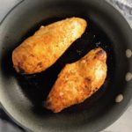 Hungarian Paprika Chicken cooking in a skillet. The paprika gives beautiful color and a deep, peppery flavor. #chicken #easychicken #easydinner #dinner #healthydinner