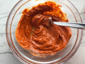 Mixing paprika and garlic into mayonnaise for the Aioli for Hungarian Paprika Chicken. The paprika gives beautiful color and a deep, peppery flavor. #chicken #easychicken #easydinner #dinner #healthydinner