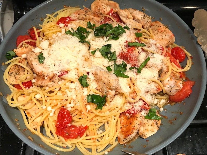 Skillet with Chicken and Cherry Tomato Pasta with basil and parmesan. It's easy and so delicious! #pasta #tomatoes #easydinner #dinner #easyrecipes #healthydinner #chicken