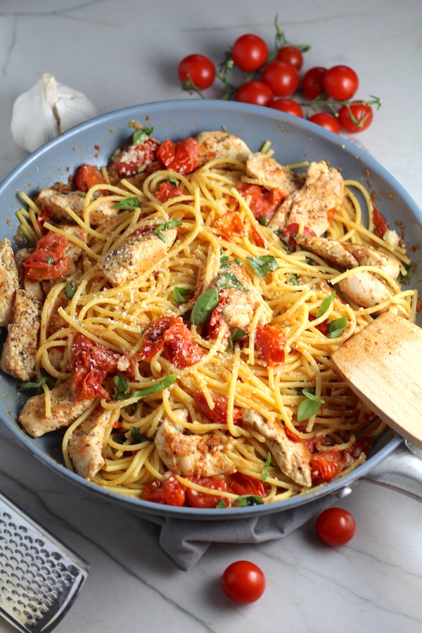 Chicken & Cherry Tomato Pasta in a skillet on counter. One of 10 Must-Try EASY Summer Dinners!