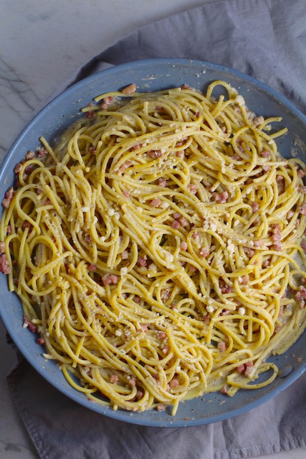 Pancetta, Parmesan, and Pepper Pasta in skillet. The Pancetta gives a salty and slightly peppery flavor, Parmesan cheese creates a nutty and creamy sauce, and the ground black pepper gives a peppery flavor that makes this pasta stand out. #pasta #easypasta #easydinner #dinner #italian #familydinner #onpotdinners #onepandinners #parmesan