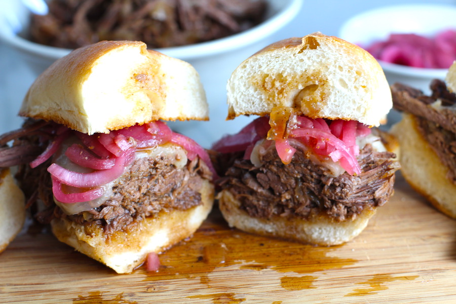 Pulled Beef Brisket Sandwich made in the Slow Cooker is smokey, savory, tender, moist, and full of flavor. In a delicious sauce, it goes great on a sandwich, over polenta, on rice, or potatoes. #slowcooker #crockpot #brisket #beefbrisket #pulledbeef #pulledpork