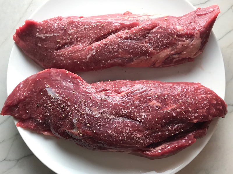 Seasoned Raw Beef Filet for Mini Beef Wellington Bites. They are flaky and buttery Puff Pastry is filled with a creamy mushroom and parmesan filling and tender beef filet.  #appetizers #partyfood