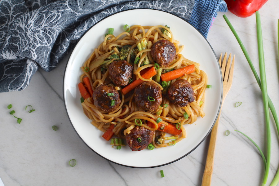 Teriyaki Meatballs with Veggie Stir Fry, and rice noodles on a plate.  #asianmeatballs #teriyaki #noodles #familydinner #easydinners #dinnerideas