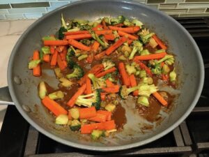 Carrots cooking in pan for Teriyaki Meatballs with Veggie Stir Fry, and rice noodles.  #asianmeatballs #teriyaki #noodles #familydinner #easydinners #dinnerideas