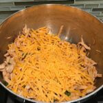 Cheese added to Shredded Chicken mixture for Chicken Taquitos. Corn tortillas are filled with smoky taco seasoned shredded chicken, and creamy cheddar cheese.  #dinnerideas #familydinner #chickenrecipes #chickendinner #tacos #taquitos