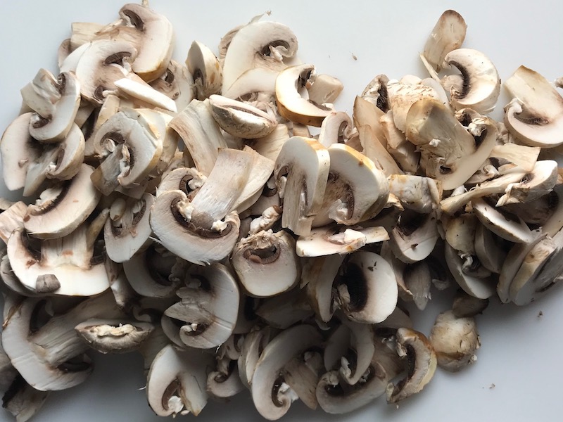 Sliced mushrooms for Vegetarian Salisbury Steak with a thick, creamy, rich Mushroom Sauce. #vegetarian #healthydinner #dinnerideas #mushrooms