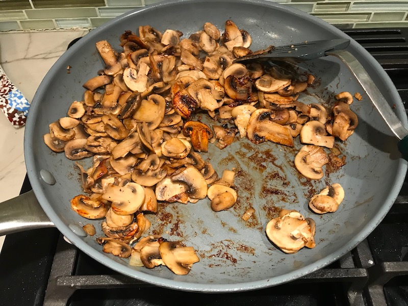 Seared sliced Mushrooms in skillet for this Heavenly Mushroom Sauce Recipe. #vegetarian #healthydinner #dinnerideas #mushrooms