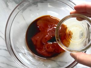 Ketchup, Sweet Chilli Sauce, & Soy Sauce in bowl for Chinese BBQ Sauce for Pork Tenderloin.  It's sweet, tangy, salty, and all together lick-your-fingers delicious!  It's also easy to make!  #chinesebbqsauce #bbq #bbqsauce