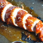 Cooked and sliced Chinese BBQ Pork Tenderloin. It's sweet, tangy, salty, and all together lick-your-fingers delicious! It's also easy to make! #chinesebbqsauce #bbq #bbqsauce