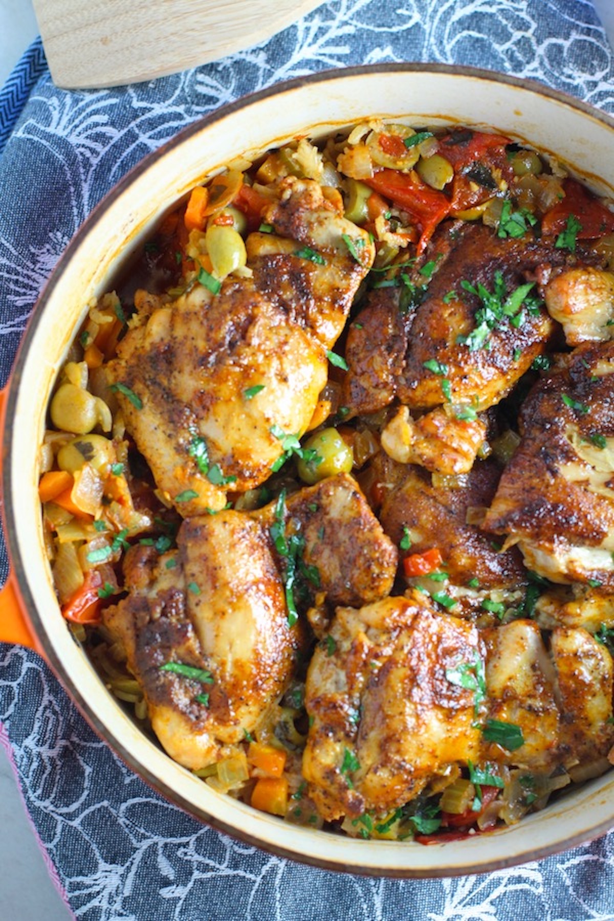 Spanish Chicken and Rice in a pot on a blue towel.  It's hearty, smokey, and delicious!
