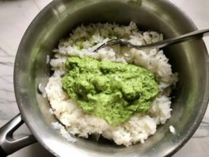 Basil, chives, spinach, and sour cream blended and added on top of cooked white rice in pot for Green Rice Recipe. It takes white rice from plain to amazing with just 5 ingredients. Filled with herbs and spinach, it has the perfect herby flavor.