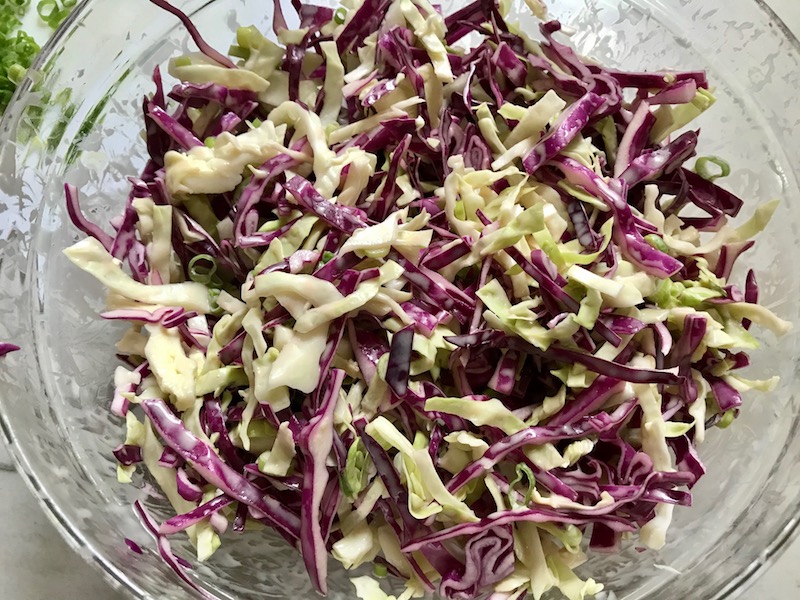 Sesame Cabbage Slaw in bowl for Korean Beef Tacos with flavorful Korean beef, crunchy Sesame Cabbage Slaw and a creamy, cool, Cilantro Lime Sriracha sauce!