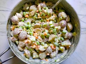 Red Potato Salad Recipe with Edamame and Harissa in a pot. It's creamy, crunchy, meaty, tangy, peppery, salty, and oh, it's UNBELIEVABLE!