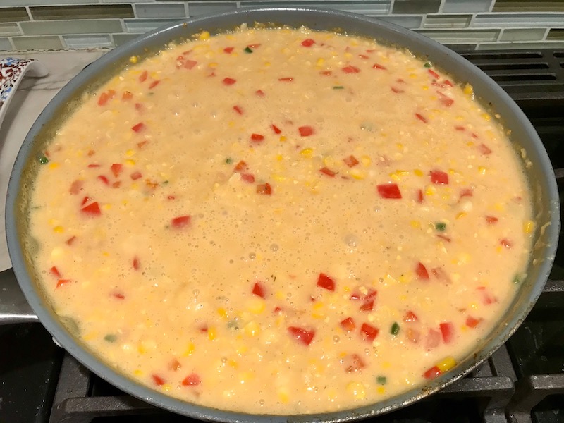 Cream Corn cooking in pan for Creamy Corn and Blackened Chicken skillet dinner