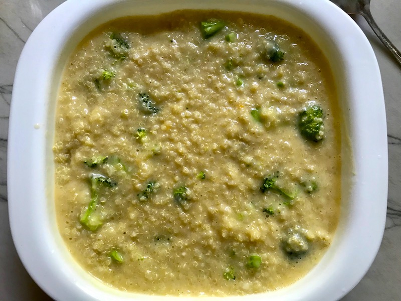 Sauce added to quinoa and broccoli for Broccoli Cheese Quinoa Bake It's a comfy cozy casserole that's perfect to make ahead for a simple weeknight side or main dish.
