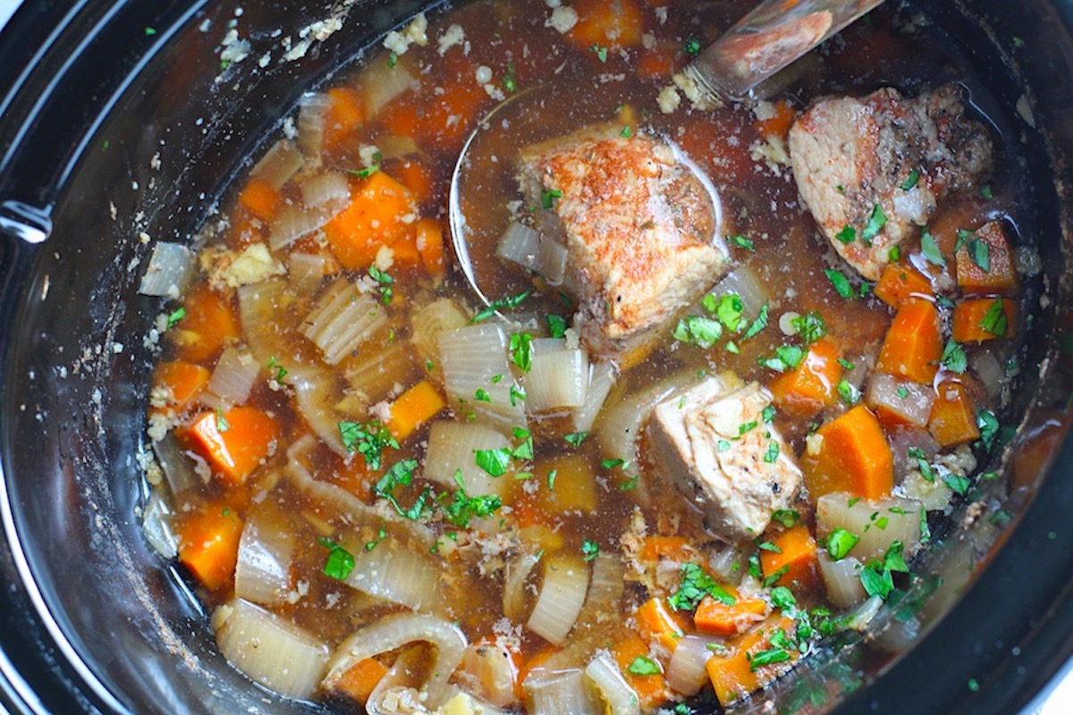 Paprika Pork Stew Recipe in a slow cooker with carrots, onion, parsley. It's an easy family dinner. 
