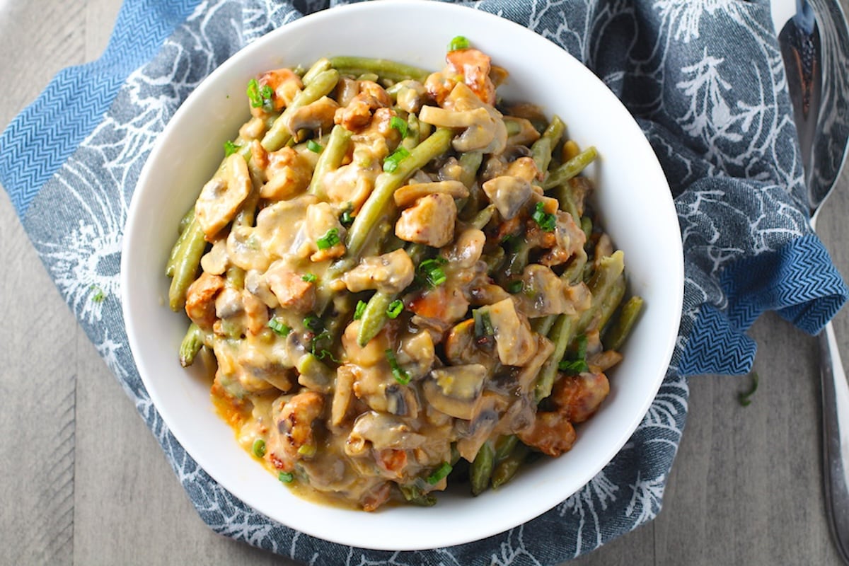 Chorizo Sausage and Green Bean Casserole in a serving bowl are a creamy and savory side dish. One of the best holiday side dishes.
