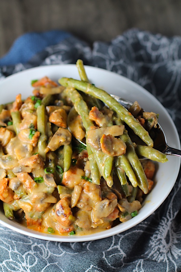 Chorizo Sausage and Green Bean Casserole in a serving bowl are a creamy and savory side dish.